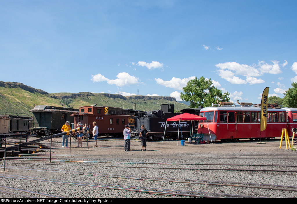 Various pieces of rolling stock surround the turntable at the Colorado Railroad Museum